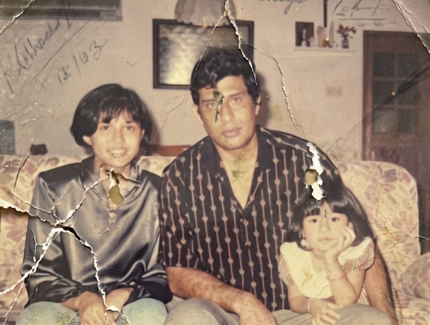 A damaged family photograph before restoration